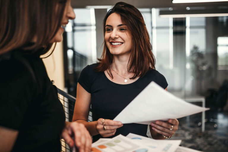 Two colleagues from work showing thumbs up